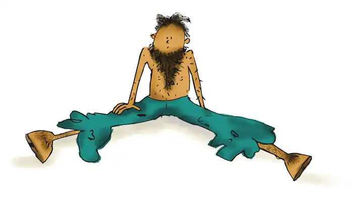 a man sits on the floor with a long dark beard no top long tatty blue trousers and hooves for feet