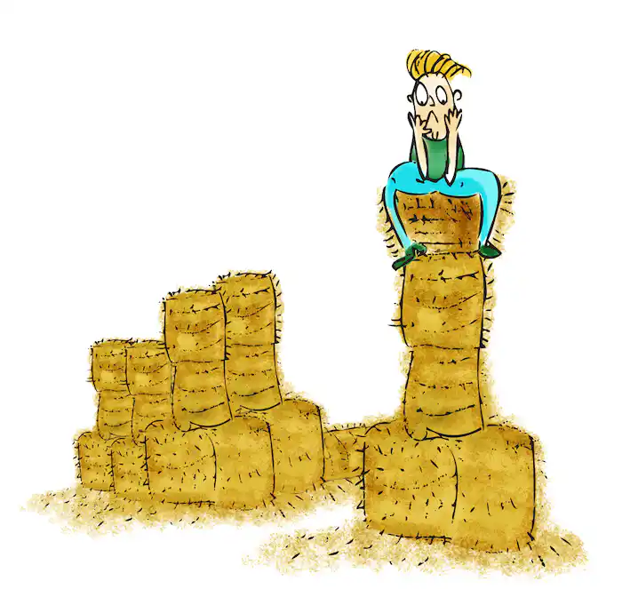 The boy sits on a high stack of straw with his hands cupping his chin.